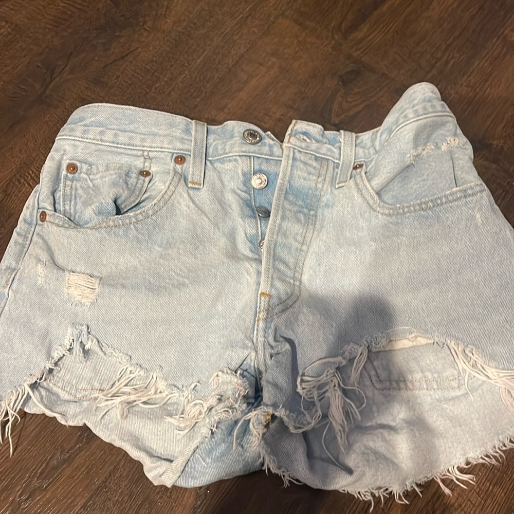 light blue denim levi 501 shorts, size 26, with rips